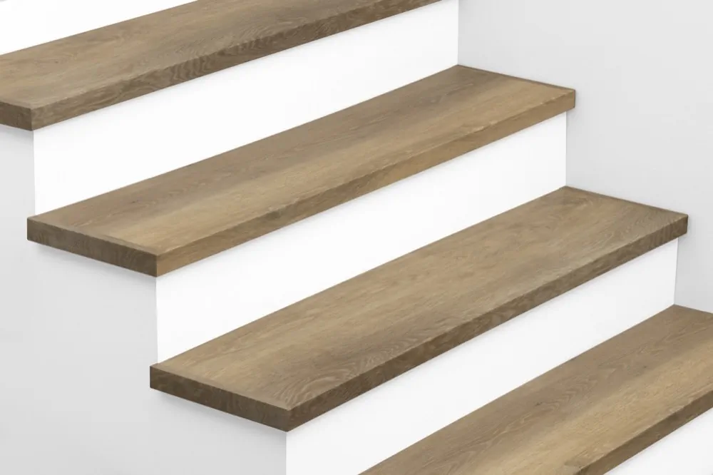 View from above of Urban Surfaces' All-In-One SPC Stair Treads installed on a staircase. Color is 2999 Yosemite from the Studio 12 SPC Vietnam product line.2999 Yosemite