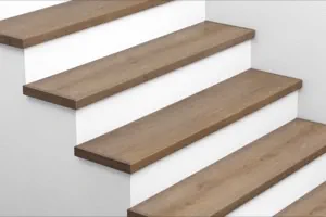 View of Urban Surfaces' All-In-One SPC Stair Treads. Color is 2903 Arrowhead from the Studio 12 FF product line.2903 Arrowhead