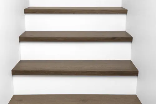 Front view of Urban Surfaces' All-In-One SPC Stair Treads installed on a staircase. Color is 2913 Hidden Acres from the T Molding product line.2913 Hidden Acres