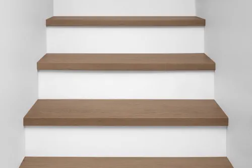 Front view of Urban Surfaces' All-In-One SPC Stair Treads installed on a staircase. Color is 9712 Mount Olympia from the T Molding product line.9712 Mount Olympia
